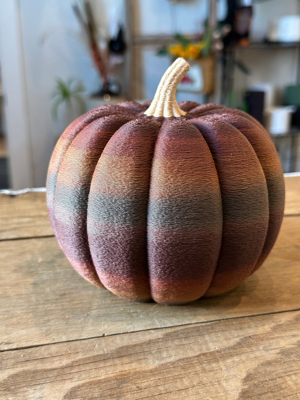 Large rustic 3D printed pumpkin with dark brown, mauve, and gray color variations and cream stem.